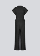 Black jumpsuit with wide legs and a tieband at the waist. NedraMD jumpsuit has a collar, v-neck, and a zipper at front.