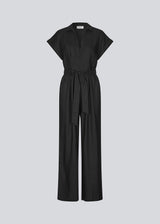 Black jumpsuit with wide legs and a tieband at the waist. NedraMD jumpsuit has a collar, v-neck, and a zipper at front.