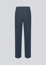 Classic navy pants in navy blue with pressfolds and straight legs. Nelli pants are closed by a hidden zipper at the side with an elastic waistband for a more comfortable fit.