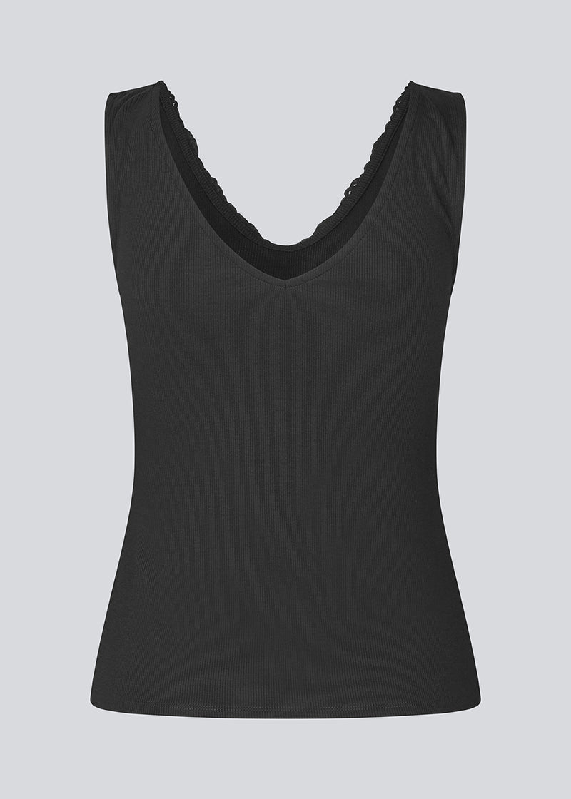 Sleeveless top with a lace in ribbed jersey. NemiMD top is fitted and has a v-neck.