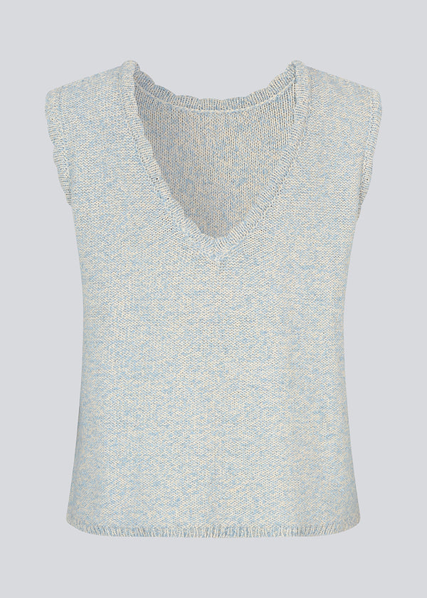Sleevless knitted top in cotton in light blue. NerissaMD top has detailed trimmings and a deep v-neckline in the back.