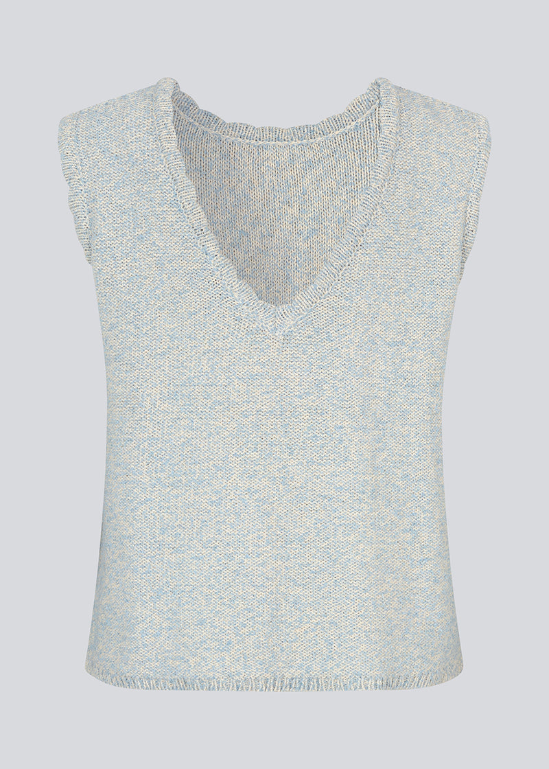 Sleevless knitted top in cotton in light blue. NerissaMD top has detailed trimmings and a deep v-neckline in the back.