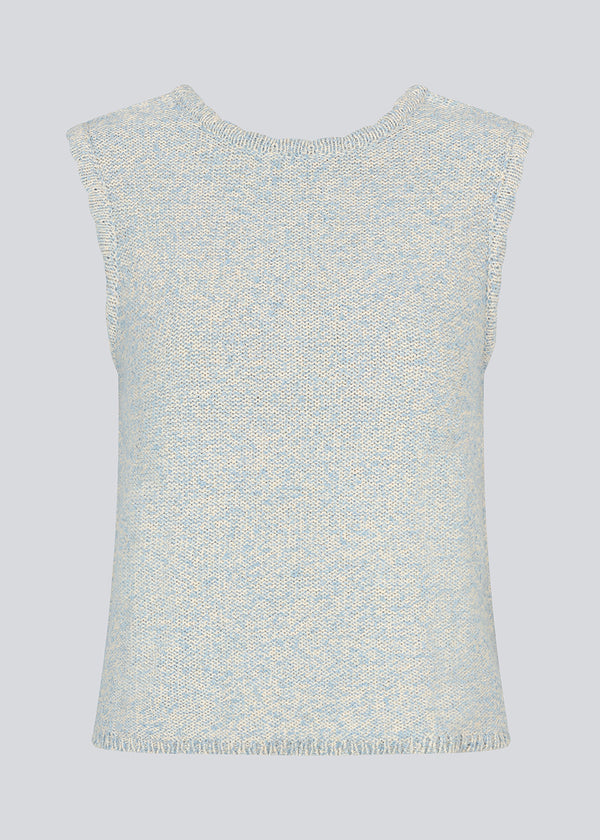 Sleevless knitted top in cotton in light blue. NerissaMD top has detailed trimmings and a deep v-neckline in the back.