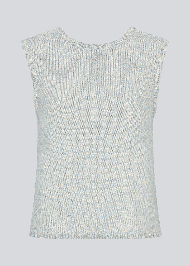 Sleevless knitted top in cotton in light blue. NerissaMD top has detailed trimmings and a deep v-neckline in the back.