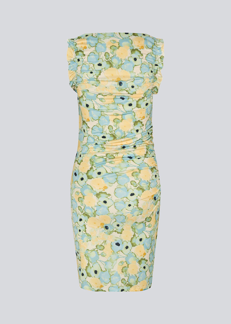 Fitted dress in 100% recycled polyester. NettieMD print dress has ruffles on the sleeves and gathers on the side. The dress has a beautiful floral print.