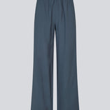 Blue pants with wide legs in EcoVero viscose. NickiMD pants have an elastic waistband and side pockets.