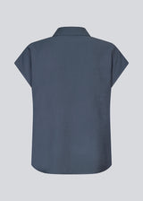 Sleeveless shirt in blue with button closure in EcoVero viscose. NickiMD SS shirt has a loose fit and gathers at the shoulder.