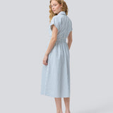 Short-sleeved dress with a v-neck and smock at the waist. NikkoMD dress has side pockets, a shirt collar, and a button closure in front.