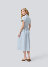 Short-sleeved dress with a v-neck and smock at the waist. NikkoMD dress has side pockets, a shirt collar, and a button closure in front.