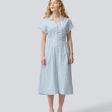 Short-sleeved dress with a v-neck and smock at the waist. NikkoMD dress has side pockets, a shirt collar, and a button closure in front.