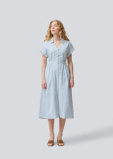 Short-sleeved dress with a v-neck and smock at the waist. NikkoMD dress has side pockets, a shirt collar, and a button closure in front.