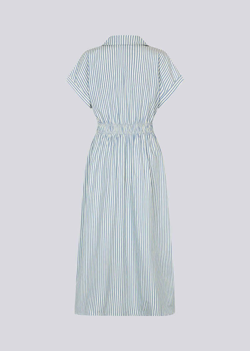 Short-sleeved dress with a v-neck and smock at the waist. NikkoMD dress has side pockets, a shirt collar, and a button closure in front.