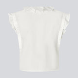 Sleeveless white top with frill details and a button closure in front. NIkkoMD top is slightly cropped and has a v-neck.