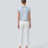 Sleeveless top with frill details and a button closure in front with stripes. NikkoMD top is slightly cropped and has a v-neck.
