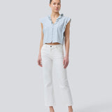 Sleeveless top with frill details and a button closure in front with stripes. NikkoMD top is slightly cropped and has a v-neck.