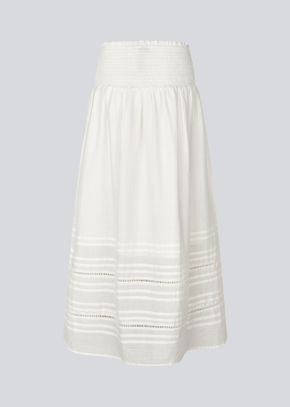 Maxi skirt in white in 100% organic cotton. NillaMD short skirt has a loose skirt with pleats and frill details, and an elastic waist with a smock.