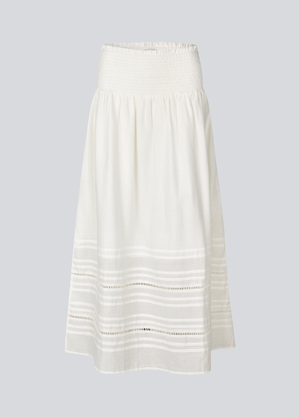 Maxi skirt in white in 100% organic cotton. NillaMD short skirt has a loose skirt with pleats and frill details, and an elastic waist with a smock.