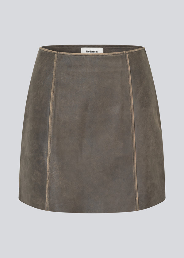 Short A-line leather skirt in lamb leather with a medium-high waist. NimaMD skirt has a vintage-inspired look and a hidden zipper on the side.