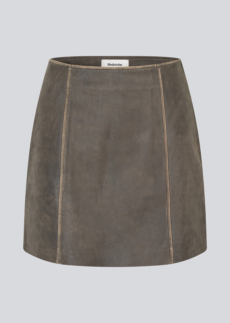 Short A-line leather skirt in lamb leather with a medium-high waist. NimaMD skirt has a vintage-inspired look and a hidden zipper on the side.