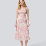 Long dress with thin straps and a waterfall detail at the front. NimraMD print dress is made in a slightly transparent material with lining.