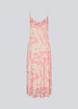 Long dress with thin straps and a waterfall detail at the front. NimraMD print dress is made in a slightly transparent material with lining.