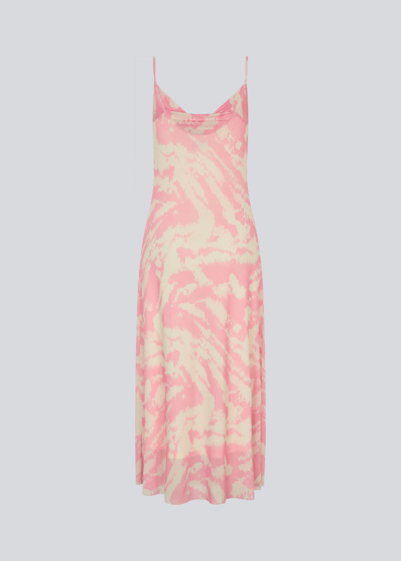 Long dress with thin straps and a waterfall detail at the front. NimraMD print dress is made in a slightly transparent material with lining.
