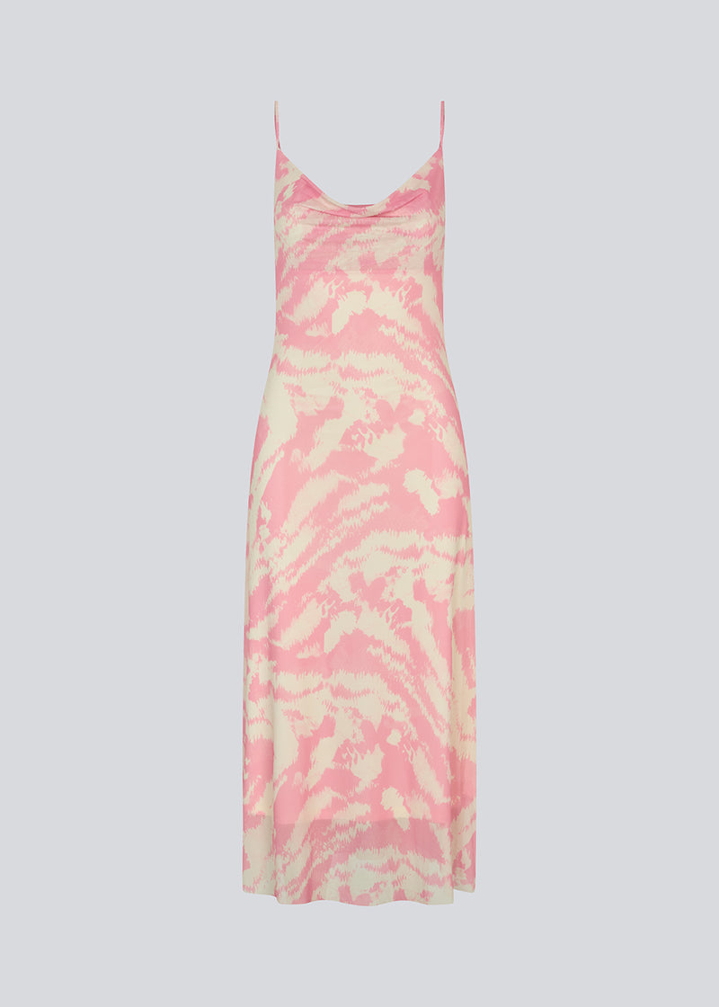 Long dress with thin straps and a waterfall detail at the front. NimraMD print dress is made in a slightly transparent material with lining.