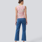 Sleeveless top in an elastic material. NimramD top has a round neck and gatherings in front.