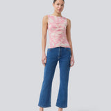 Sleeveless top in an elastic material. NimramD top has a round neck and gatherings in front.