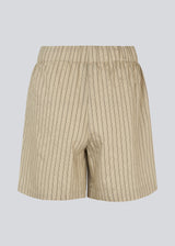 Loose shorts with a tieband at the waist. NolandMD shorts have side pockets and an elastic waistband.