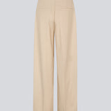 NormaMD pants in beige have a medium-high waist, zipper, side pockets, and paspoil pocket in the back.