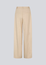 NormaMD pants in beige have a medium-high waist, zipper, side pockets, and paspoil pocket in the back.