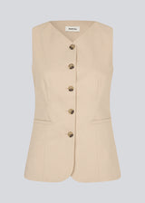Fitted vest with a v-neck. NormaMD top has a button closure and two pockets in front.