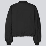 Padded black bomber jacket with gatherings at the sleeves. Obimd jacket is slightly cropped and has a zipper closure and two front pockets.&nbsp;