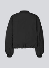 Padded black bomber jacket with gatherings at the sleeves. Obimd jacket is slightly cropped and has a zipper closure and two front pockets.&nbsp;