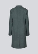 Beautiful, knee-length wool coat in dark olive green. Odelia coat is closed at front by 4 buttons and is fitted around the waist, which gives a feminine look. Because of the high content of wool the jacket will be perfect for fall and the mild winters.