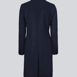 Beautiful, knee-length wool coat in navy sky. Odelia coat is closed at front by 4 buttons and is fitted around the waist, which gives a feminine look. Because of the high content of wool the jacket will be perfect for fall and the mild winters.