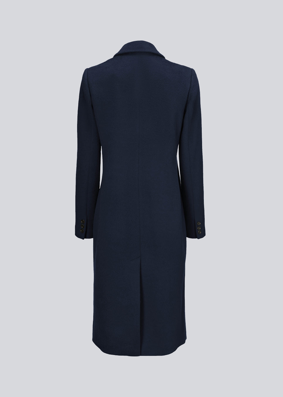 Beautiful, long woolen coat in navy blue. Odelia long coat is double-breasted and slightly fitted at the waist for a feminine expression. The coat is an obvious choice for both fall and mild winters.