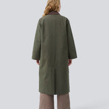 Padded coat in dark army with a contrast corduroy collar in brown. Odettemd coat has a hidden zipper closure, slit and two front pockets. The model is 175 cm and wears a size s/36.