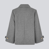 Classic short jacket in a wool mix. Ofiamd jacket has a relaxed fit, hidden button closure and collar. The model is 175 cm and wears a size s/36.