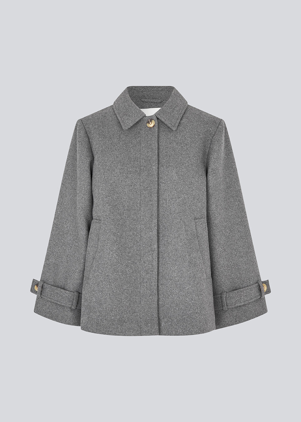 Classic short jacket in a wool mix. Ofiamd jacket has a relaxed fit, hidden button closure and collar. The model is 175 cm and wears a size s/36.