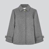 Classic short jacket in a wool mix. Ofiamd jacket has a relaxed fit, hidden button closure and collar. The model is 175 cm and wears a size s/36.