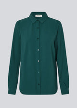Classic shirt in a loose and relaxed silhouette. Ossa shirt has a small collar, slim cuff and buttons in a matching colour for a sleek design.