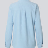 Classic shirt in light baby blue in a loose and relaxed silhouette. Ossa shirt has a small collar, slim cuff and buttons in a matching colour for a sleek design.&nbsp;