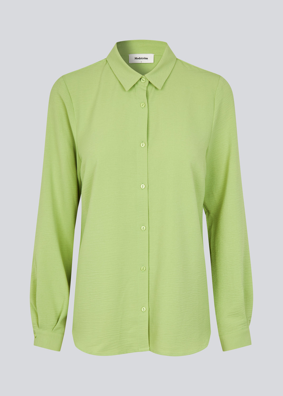 Classic green shirt in a loose and relaxed silhouette. Ossa shirt has a small collar, slim cuff and buttons in a matching colour for a sleek design.

Material:
100% Polyester