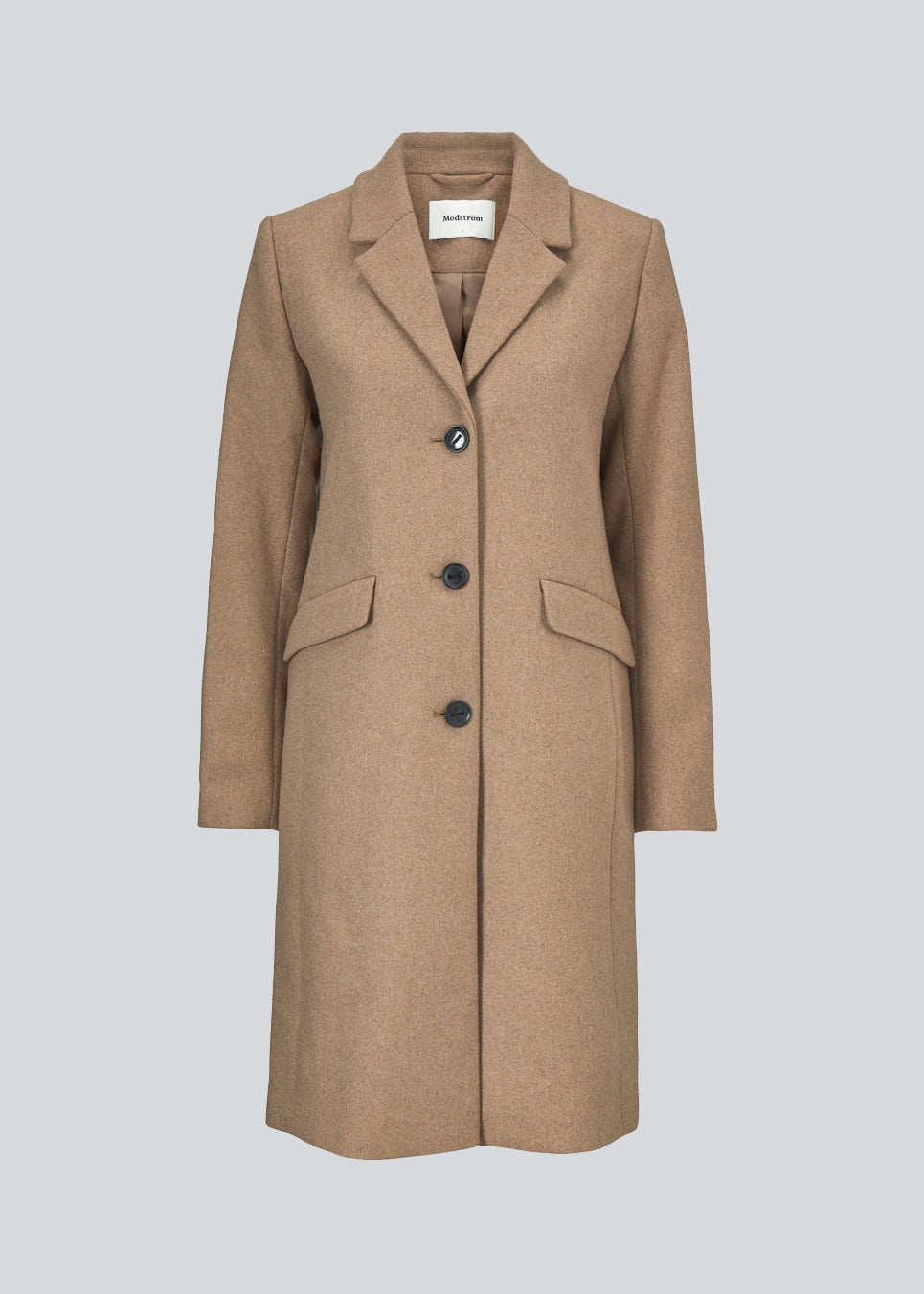 Beautiful, long wool coat i beige. Pamela coat is closed by 3 big buttons at front and is waisted, which gives a feminine look. Because of the high content of wool you will be able to keep warm all through fall and the mild winters.