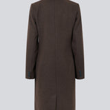 Beautiful, long wool coat in dark brown. Pamela coat is closed by 3 big buttons at front and is waisted, which gives a feminine look. Because of the high content of wool you will be able to keep warm all through fall and the mild winters. The model is 176 cm and wears a size S/36