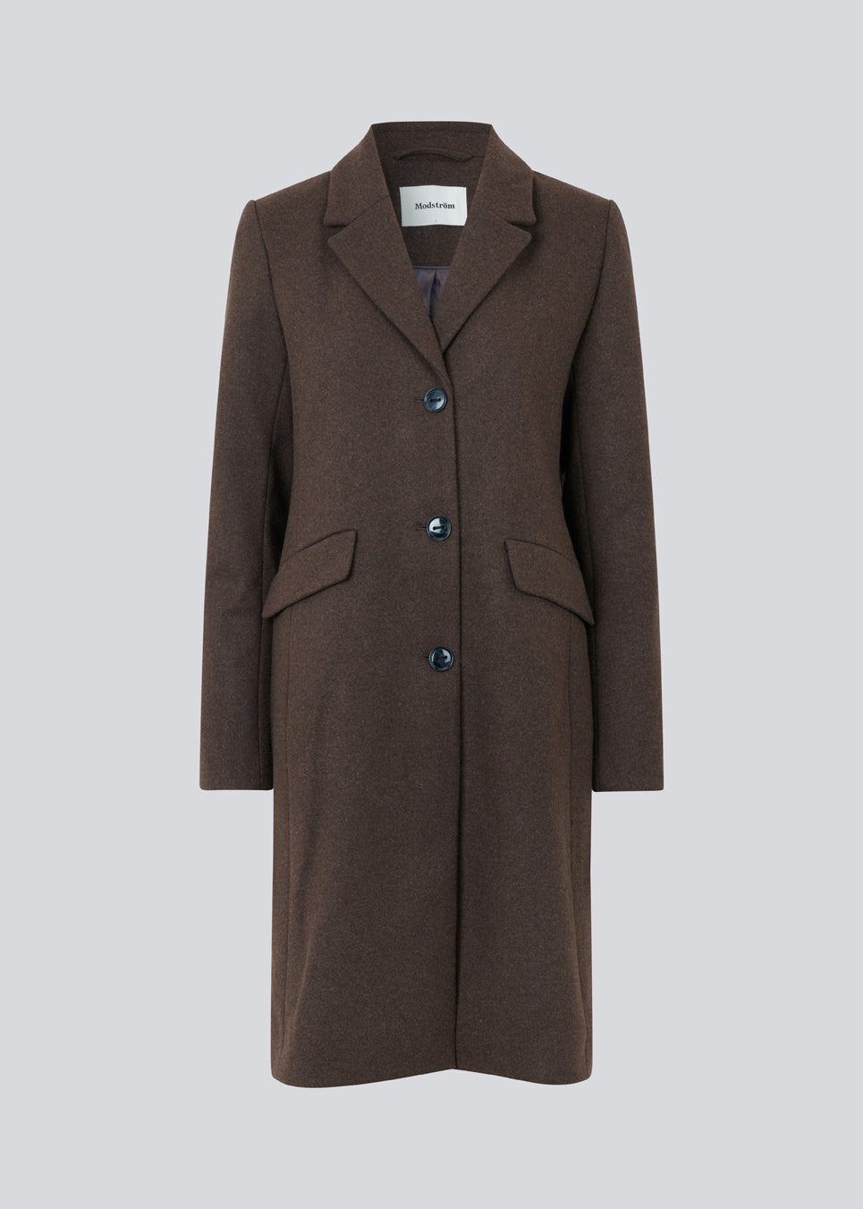 Beautiful, long wool coat in dark brown. Pamela coat is closed by 3 big buttons at front and is waisted, which gives a feminine look. Because of the high content of wool you will be able to keep warm all through fall and the mild winters. The model is 176 cm and wears a size S/36