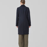 Beautiful, long wool coat in navy. Pamela coat is closed by 3 big buttons at front and is waisted, which gives a feminine look. Because of the high content of wool you will be able to keep warm all through fall and the mild winters.
