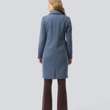 Beautiful, long wool coat. Pamela coat is closed by 3 big buttons at front and is waisted, which gives a feminine look. Because of the high content of wool you will be able to keep warm all through fall and the mild winters. The model is 176 cm and wears a size S/36